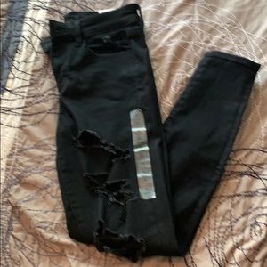 Distressed black American eagle jeans
